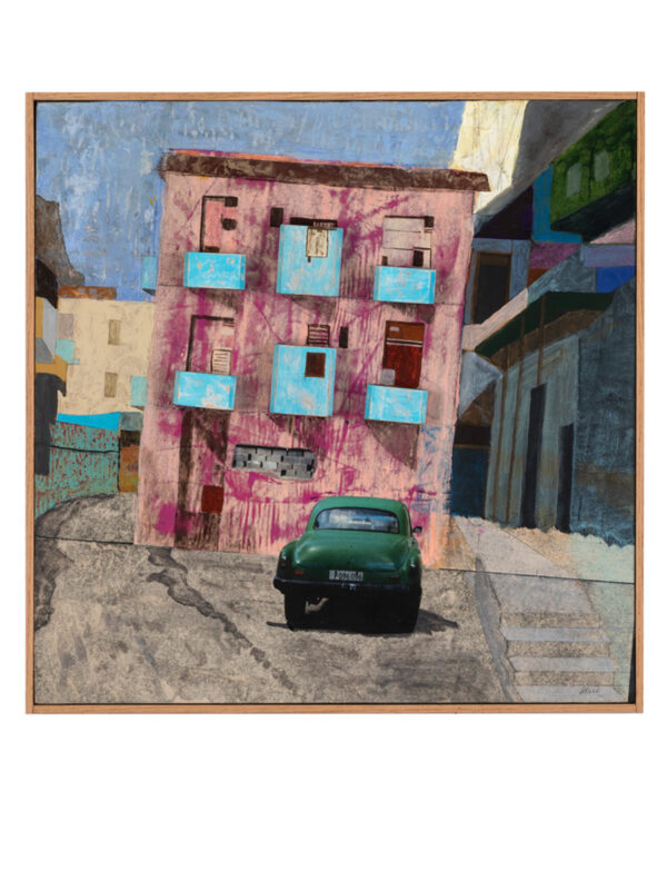 Pink building with green car parked outside.