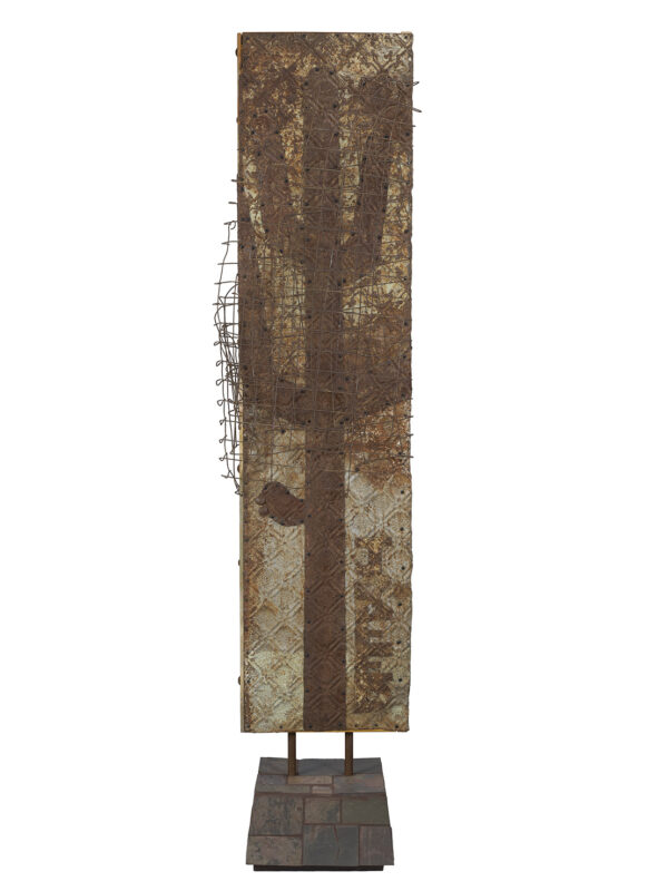 Rustic metal sculpture of a cactus shape.